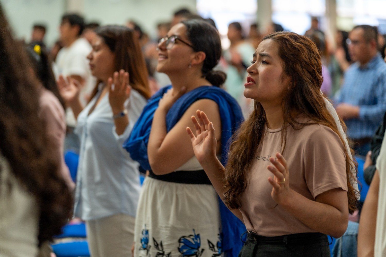 Women worshipping together